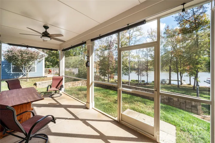 Screen porch overlooking the dock just across from the golf course