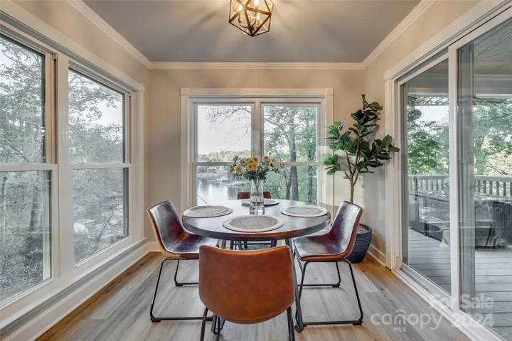 Imagine starting your day with a steaming cup of coffee as the sun paints the lake in golden hues. This inviting breakfast area offers the perfect setting to enjoy your morning meal surrounded by stunning natural beauty.