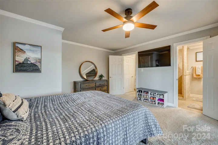 Whether you're an avid birdwatcher, a sunrise enthusiast, or simply seeking a peaceful escape, this primary bedroom with its direct access to the back deck and stunning lake vistas is sure to become your favorite spot in the house.