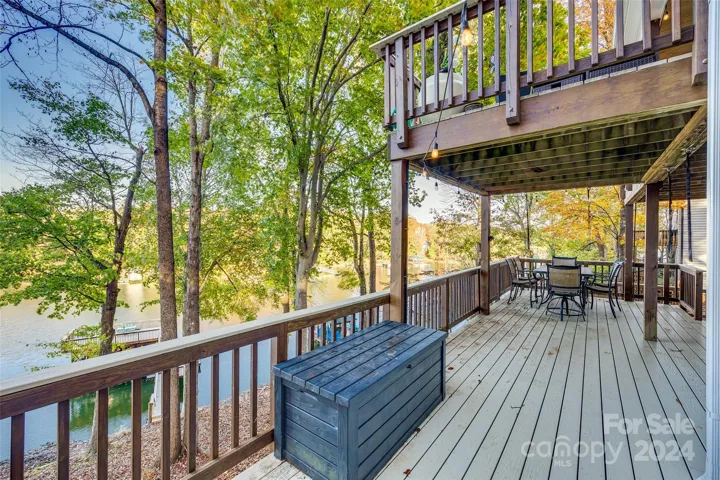 The deck's generous size provides ample space for comfortable seating, dining areas, and even a dedicated gas line for a grill station or fire table.