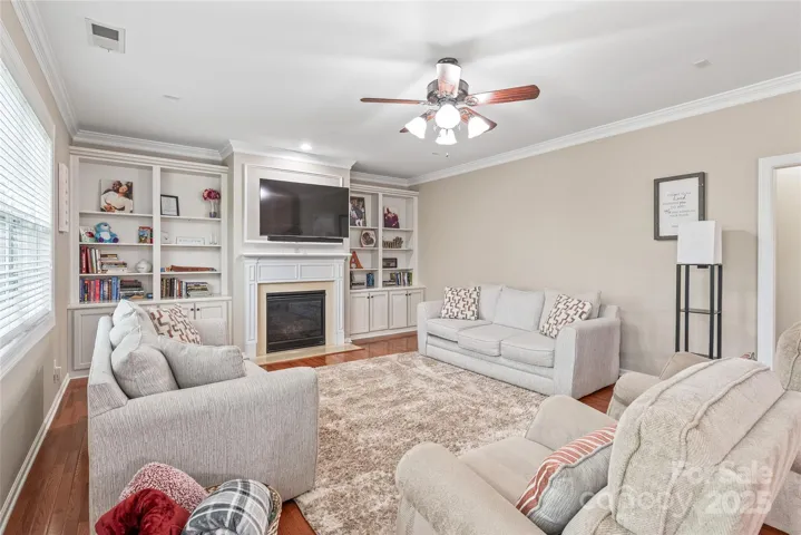 Built-ins flank the gas fireplace