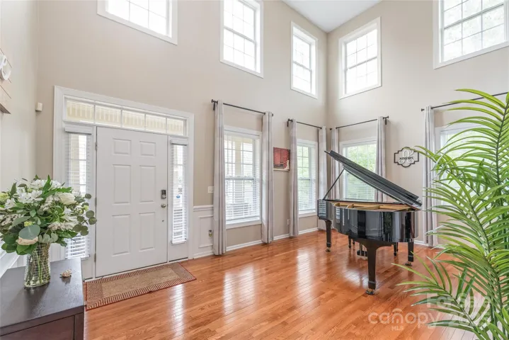 Natural light, shining floors, and a welcoming feeling greet you when you enter this spacious home.