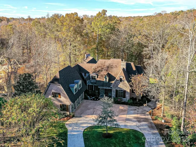 Home sits on a 2.1 acre wooded lot with Circular driveway