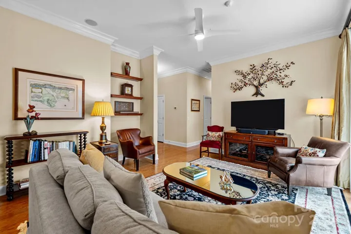 Gleaming hardwood floors add warmth and sophistication. Crown molding provides a touch of timeless craftsmanship and elegance.