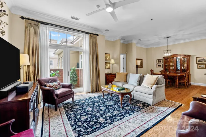 Open floor plan seamlessly connects the living space with the dining space -- perfect for daily dining and for casual or more formal entertaining. Glass door with transom window leads to a private balcony where you an enjoy a morning coffer or evening drink.