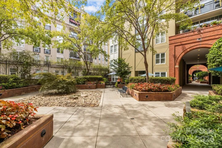 Lushly landscaped courtyard serves as a serene outdoor retreat for residents and offers a peaceful escape from the hustle and bustle of city living.