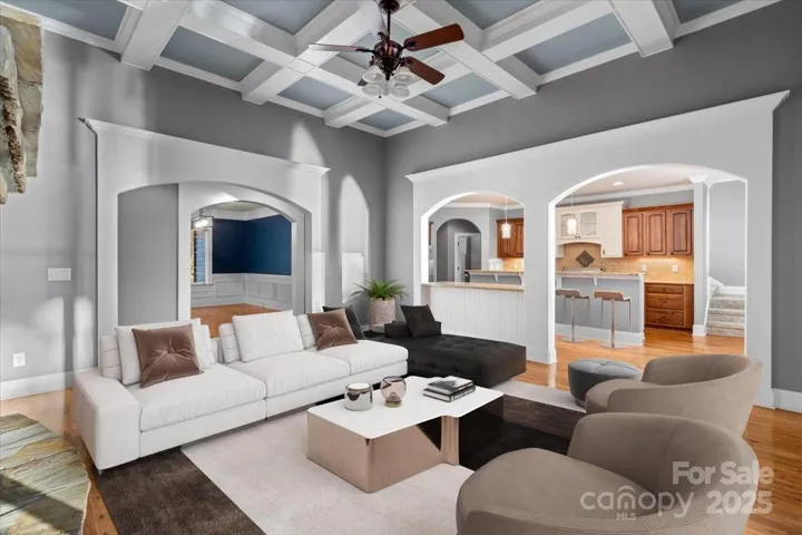 Virtually Staged living room area with coffered ceiling and nice open floorplan