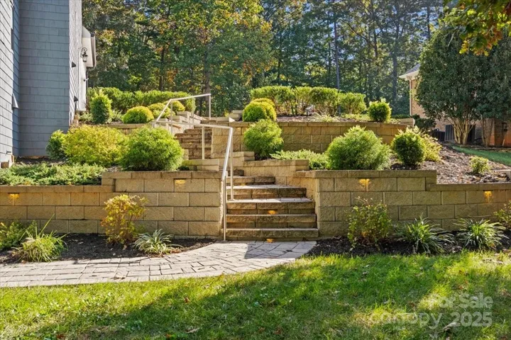 Elegant backyard landscaping and paver patios with lighting.