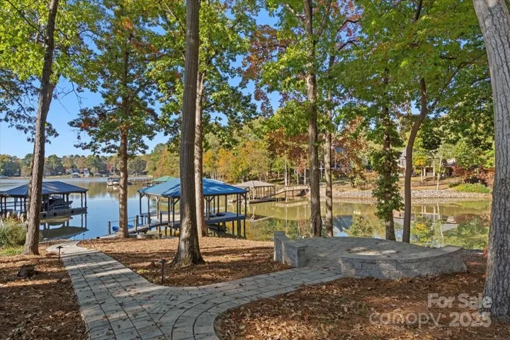 $101k price reduction! 6286 sqft, a full second living quarters, and a lake front yard that looks like this, perfection in the Sherrills Ford Schools district offering Bandys High School, Mill Creek Middle and Sherrills Ford Elementary.