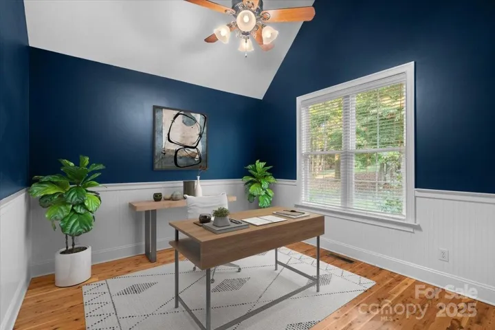 Virtually staged office on main floor overlooks the treed front yard and elgeant curving driveway on 1.6 acres of land!