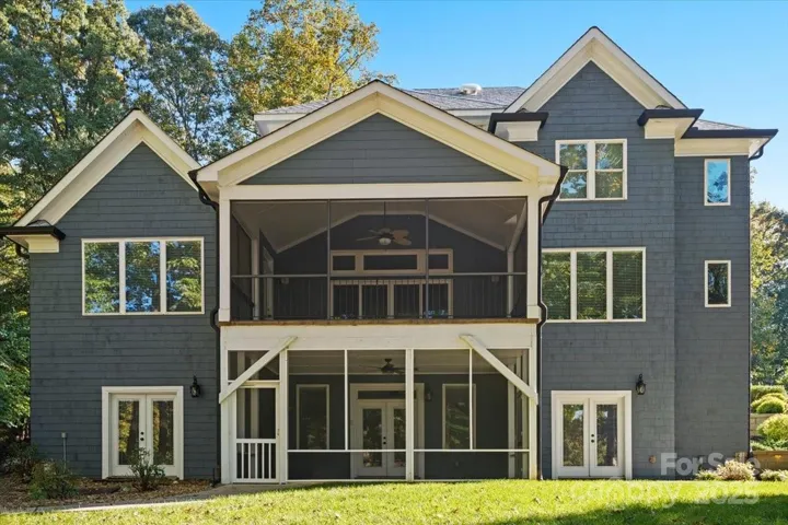 Two beautiful screen rooms and a nearly flat backyard designed for an eventual swimming pool!