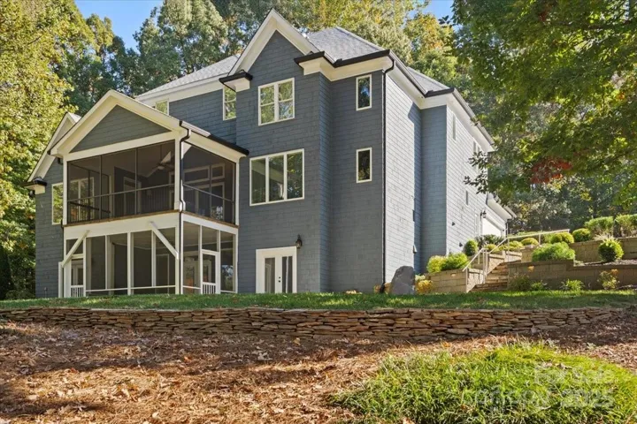 Such a stately home with stunning views over Lake Norman, the flat backyard, and room for a pool if you want!  (septic system out front so no worries about room here for more in the backyard!