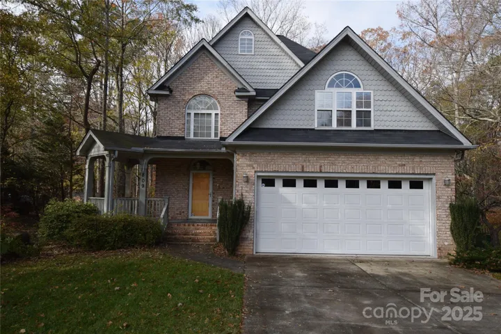 Unique full brick home with covered front porch.