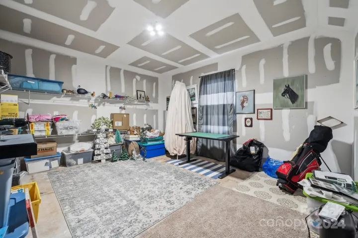 Unfinished space with electric- home gym, storage, additional bedroom. The possibilities are endless.