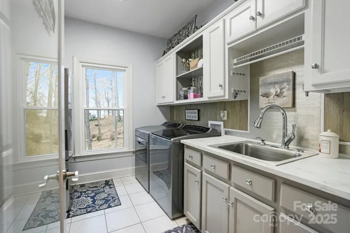 Fully loaded laundry room with W/D and tons of storage plus additional refrigerator