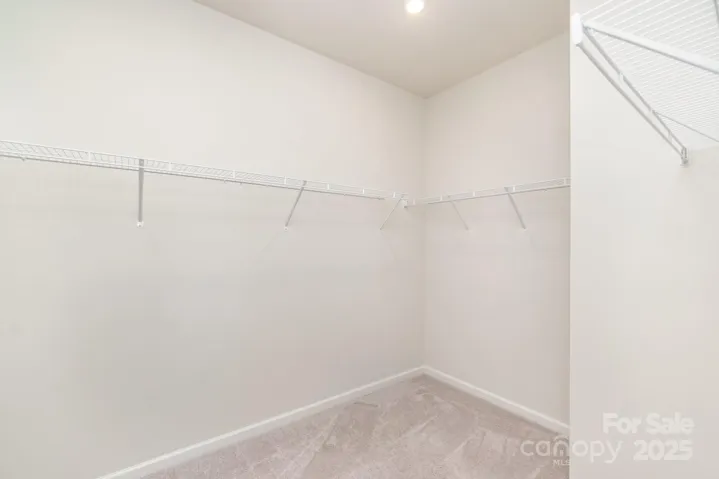 primary bedroom walk-in closet