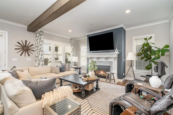 Wooden beams adorn the oversized family room