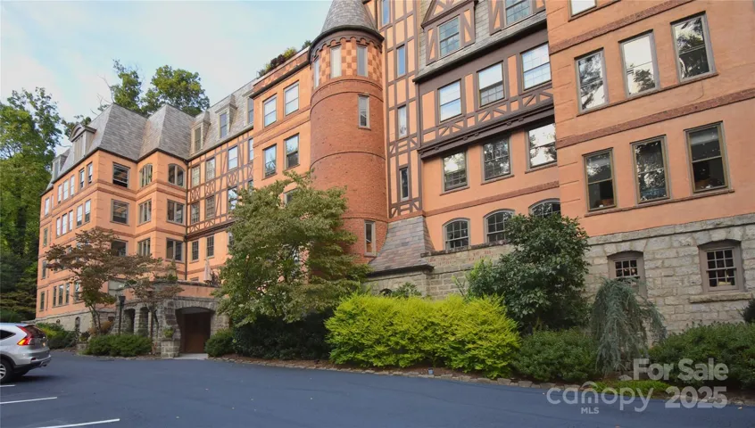 Rare two-unit property in Historic Longchamps Private Residences on Macon Avenue designed by famed architect Ronald Greene, located one block from the world class Grove Park Inn.