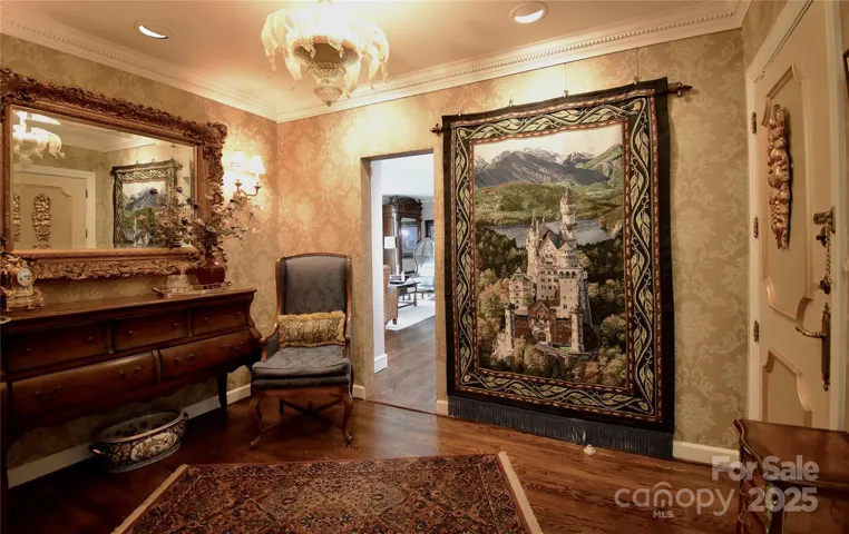 Lush damask cornsilk and molasses colored papered walls in B10 foyer welcomes guests into this exceptional unit and unites it with unit B9, presently utilized as the primary suite.