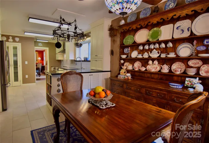 Kitchen features a breakfast room with rich taupe walls.