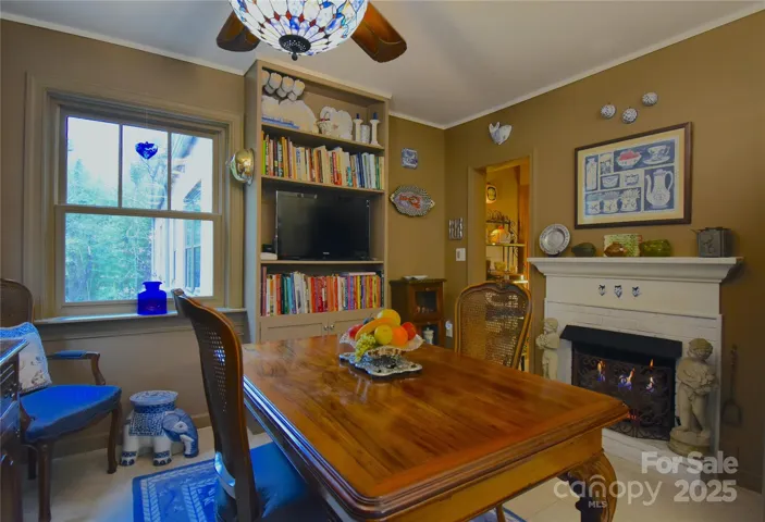 Original fireplace anchors the breakfast room.