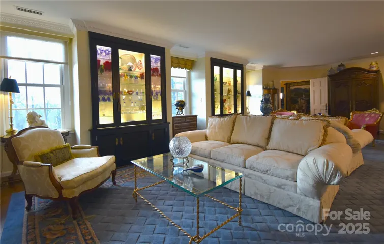 The beautiful lacquered built-in display cases are framed by three west facing large dormer windows.