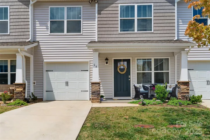 Move in ready townhome with level driveway and 1 car main level garage