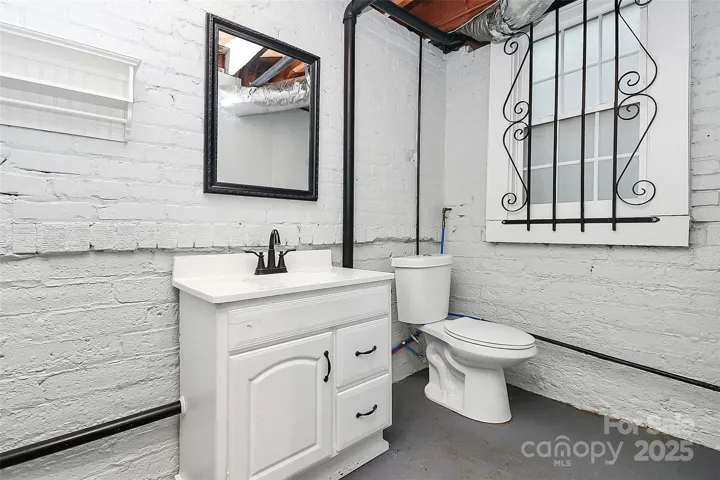 1/2 bath located in unfinished basement.