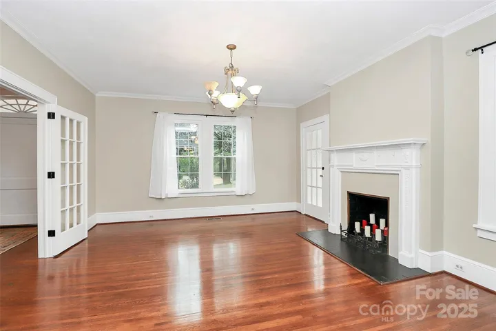 Double French doors lead to this charming den.