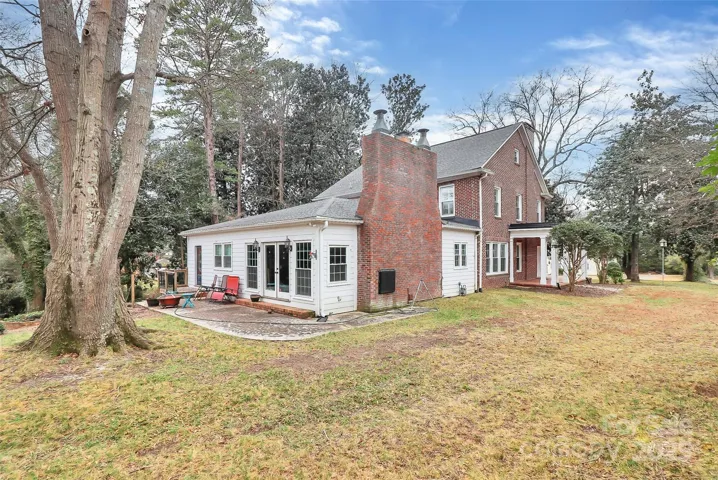 Rear of home with amazing old trees and tons of privacy in the city.