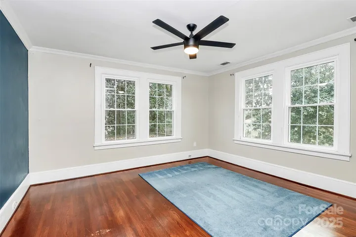 3rd bedroom on the 2nd floor with hardwood floors, flat ceilings and a ceiling fan.