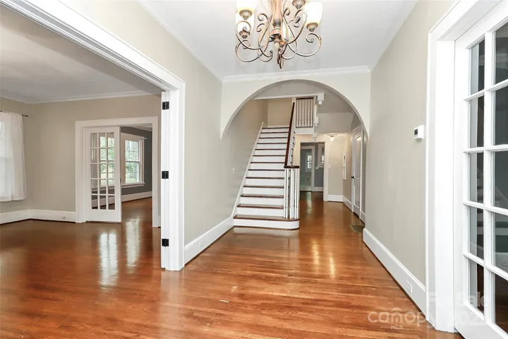 Gleaming hardwoods floors throughout this historic charmer, starting in this beautiful foyer.