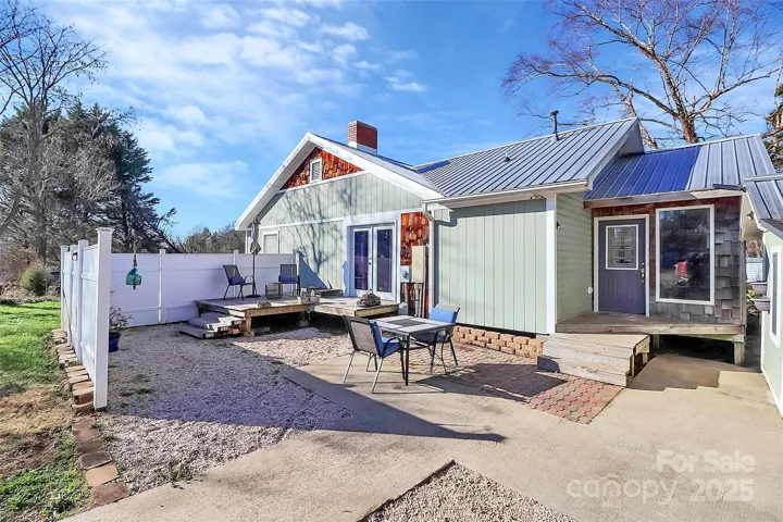 Partially fenced in back deck and side porch