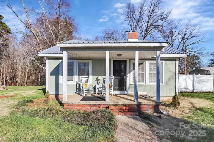 Main home with rocking chair front porch