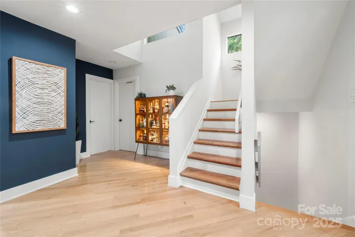 stairwell up to primary bedroom and down to the basement
