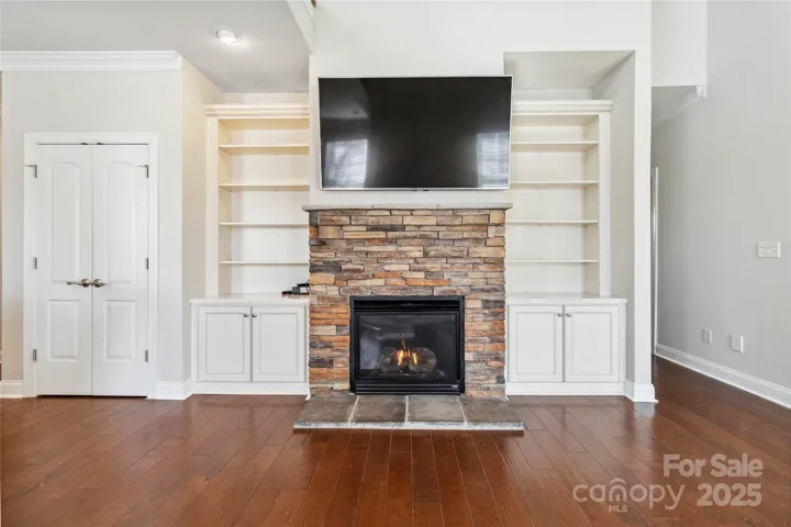 Gas log fireplace and built in shelves