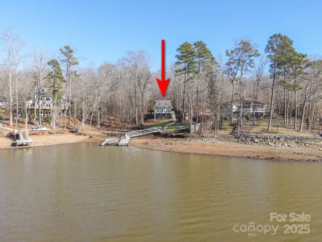 View from Lake of Beautiful, Waterfront, 2 Story/Basement, 3 Bedroom, 3 Bath Home with private pier/dock located on 3.51 acres of ultra private, gorgeous, wooded land!