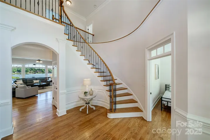 Elegant Foyer with beautiful spiral staircase.