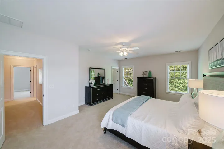 Upper Level bedroom#2.   Check out the huge storage room located through the walk-in-closet.  There's also a walk up storage/mechanical attic area.