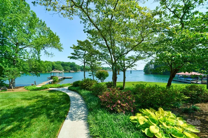 Walkway leading to private beach and private boat dock