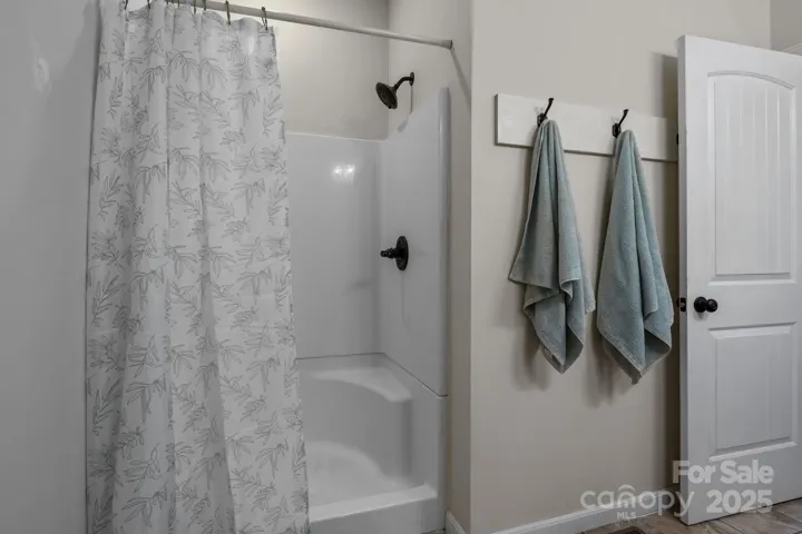 Step in shower in the primary bathroom