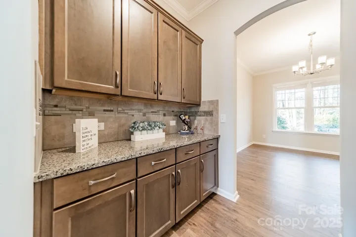Butler pantry, between the kitchen and dining room is fabulous for entertaining and for keeping your guest-serving items close at hand, without using your day-to-day kitchen space.