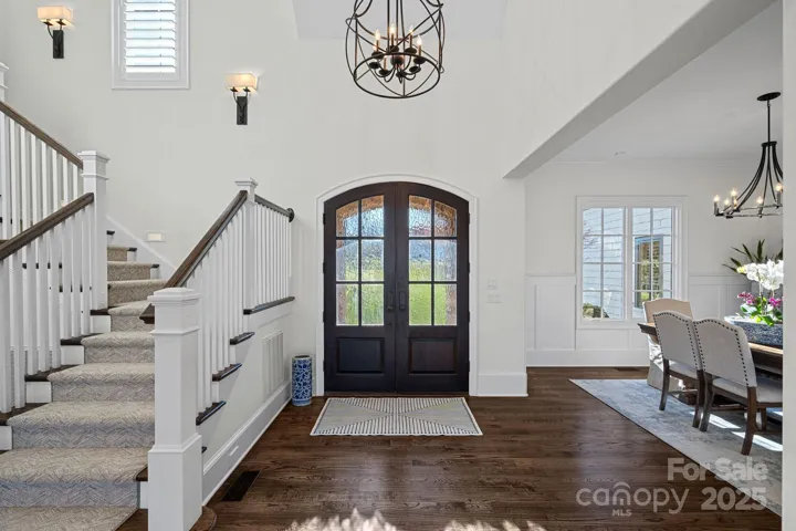 Stunning two story foyer with hardwood floors