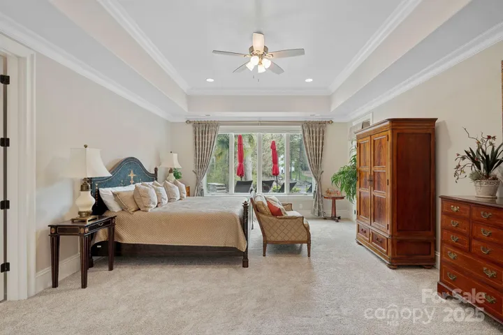 Bedroom 5 on lower level overlooking backyard and Lake