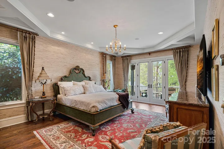 Primary Bedroom with Balcony overlooking Lake