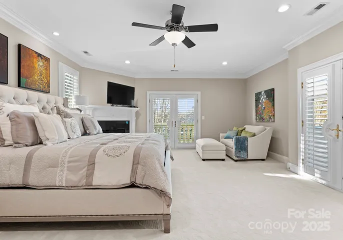 Guest suite with ensuite, fireplace, and a balcony.
