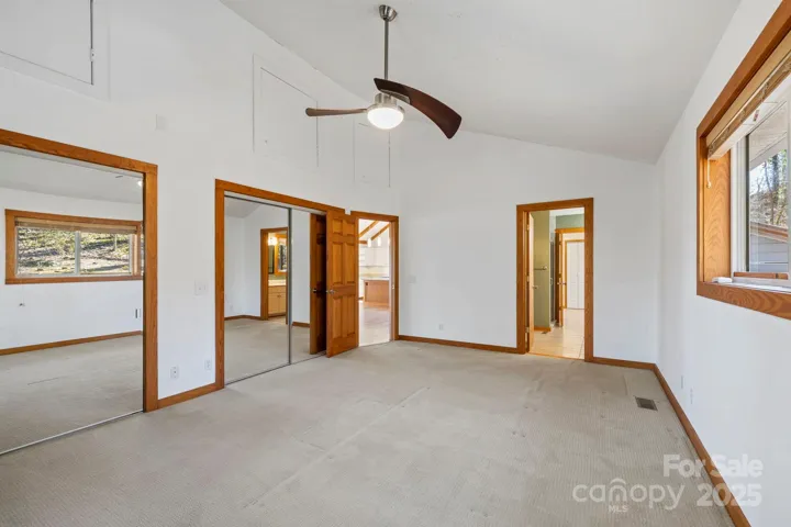 Primary bedroom- two storage areas up high