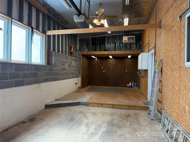 Here is the other loft space. Notice the hanging furnace that is capable of heating this space nicely. A tremendous workshop area!