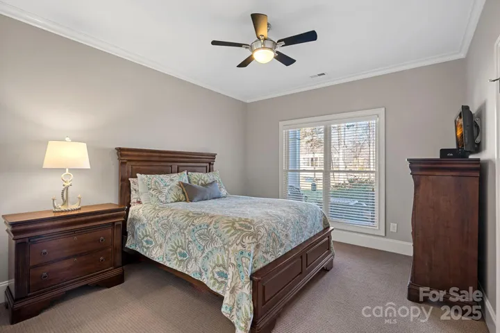 Guest bedroom #1 with lake views and access to shared full bathroom