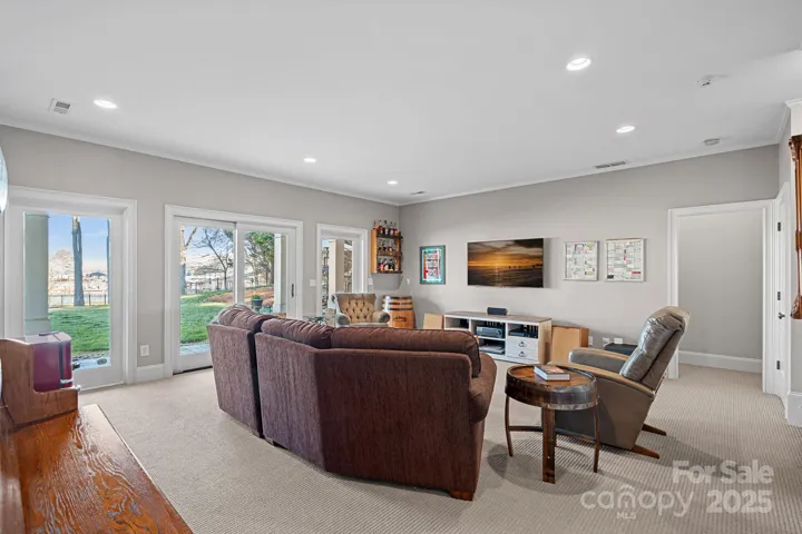 Bonus room in walk-out basement with lake views and access to covered patio.